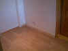 Completed conversion showing laminate floor and finish quality
