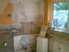 Having removed the old units & wired in a new ring main we await the plasterer .....