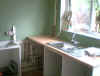 After the plasterer has been, starting to rebuild the kitchen with new sink & worktop but using old base units .....